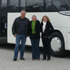 Mr. Stracke and his daughters in front of their new S 415 UL on the grounds of the Setra Customer Centre in Neu-Ulm